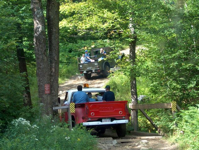 Ken See's M37 heading uphill AFTER GOING THRU THE WATER STREAM, the option other than the wooden bridge.  Same stream as "The Big White Truck" did last year, as well as few others.
