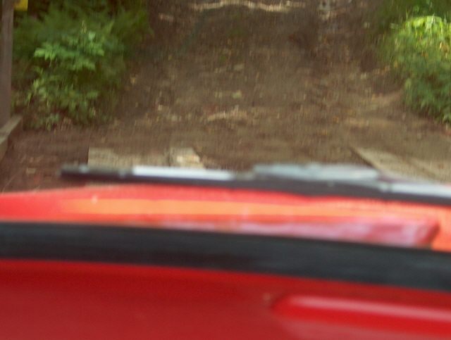 Ron heading over the wooden bridge with his red 59 W200
Wiser than the water stream this time
