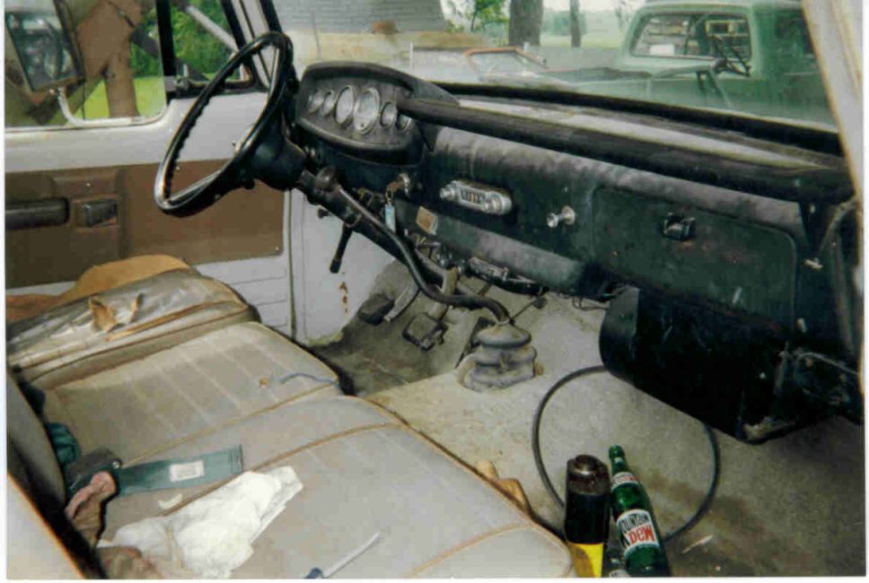 Original interior, tan seats with green carpet.
